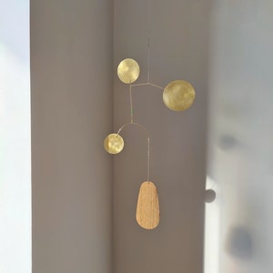 Modern kinetic mobile. mid century art decor. Brass, wood hanging sculpture. adult baby mobile. living room wall decoration. Ceiling mobile