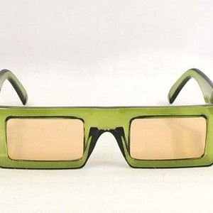 May include: Green rectangular sunglasses with a light brown lens.