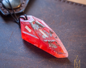 Entry Serpent, translucent pendant made of light red resin and green glowing inlays, futuristic jewelry, cyberpunk, sci-fi, tron