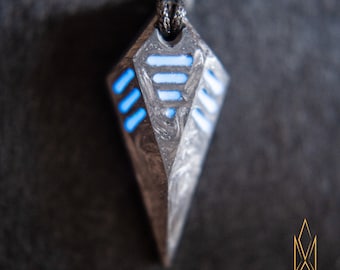 Spectre, codename "Carbon Decade", glowing pendant crafted of forged carbon fiber, cyberpunk, sith, tron, futurism, cosmic, industrial