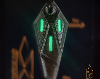 Entry Serpent, translucent pendant made of cold shadow grey resin, green glowing inlays, futuristic jewelry, cyberpunk, sci-fi, tron