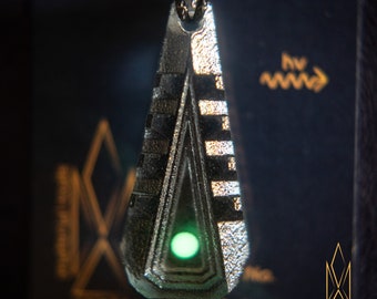 Entry Tactility, translucent geometric pendant made of shadow grey resin, green glowing inlays, futuristic jewelry, cyberpunk, sci-fi, tron