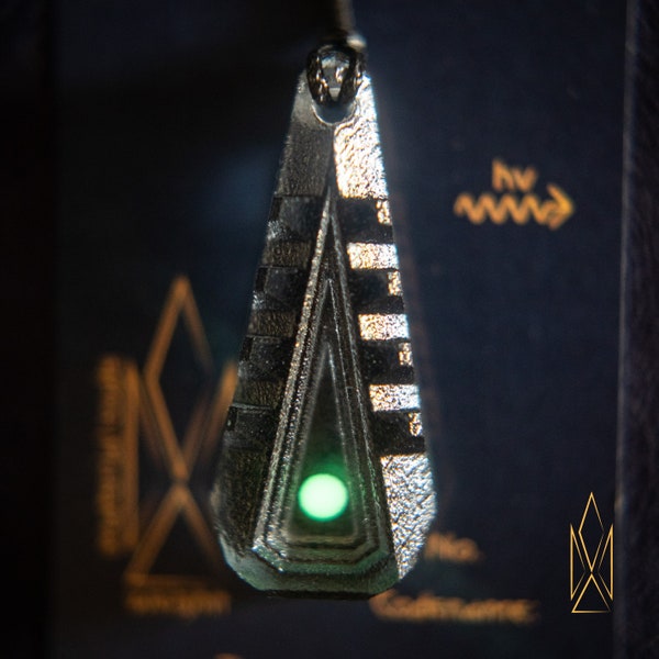 Entry Tactility, translucent geometric pendant made of shadow grey resin, green glowing inlays, futuristic jewelry, cyberpunk, sci-fi, tron