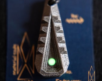 Tactility, glowing fidget pendant made of titanium matrix composite, futuristic, aerospace, cosmic, composite jewelry, cyberpunk, sci-fi