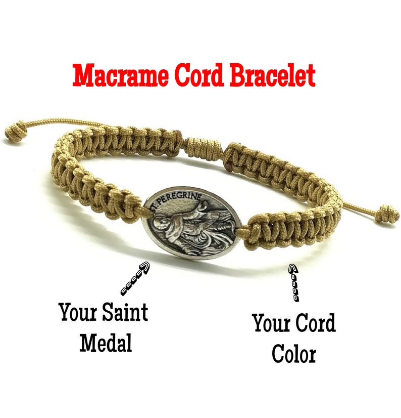 May include: A brown macrame cord bracelet with a silver oval medal featuring a depiction of Saint Peregrine. The medal is attached to the bracelet with a knot.