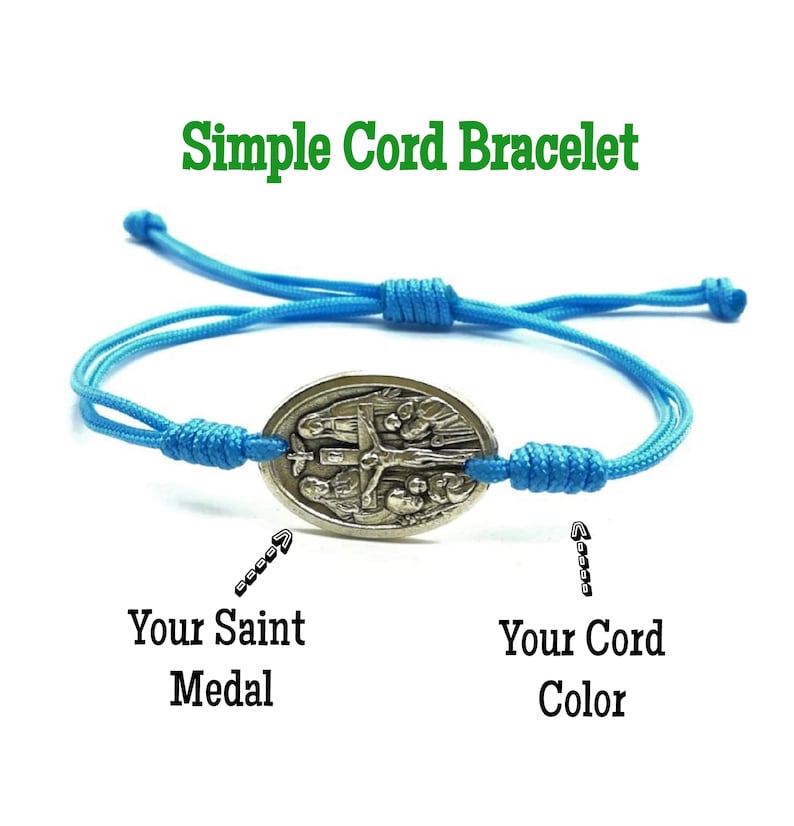 May include: A simple cord bracelet with a silver oval charm featuring a religious image. The bracelet is blue and the charm is silver. The text "Your Saint Medal" and "Your Cord Color" is written below the bracelet.