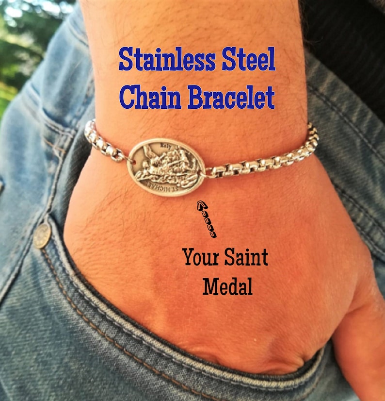 May include: Stainless steel chain bracelet with a silver oval pendant featuring a religious image. The text "Stainless Steel Chain Bracelet" and "Your Saint Medal" is visible in the image.
