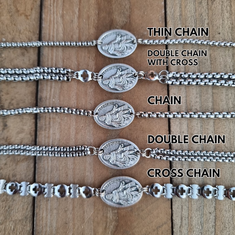 May include: Five silver bracelets with a religious pendant featuring the image of Saint Peregrine. The bracelets feature different chain styles, including thin chain, double chain with cross, chain, double chain, and cross chain.