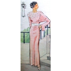 May include: A pink floor-length dress with a white lace collar and a matching belt. The dress has long sleeves with wide cuffs. The model is standing on a staircase with a railing.