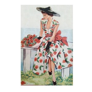May include: A woman in a white dress with red floral print sits on a bench with a bouquet of red flowers. She is wearing a black hat with a wide brim and black gloves.