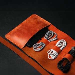 a leather case with cords and cords in it