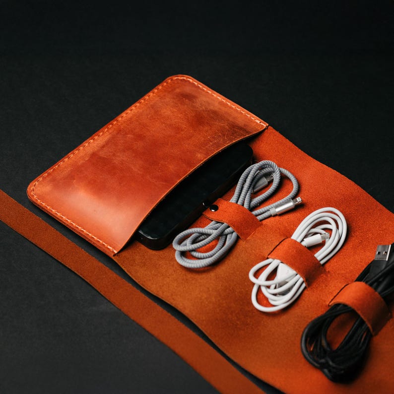 a leather case with cords and cords in it