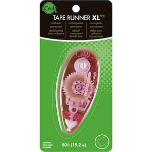 May include: A pink tape runner dispenser with a clear plastic body and a green and white label that reads "iCraft TAPE RUNNER XL". The label also includes the text "refillable permanent double-sided clear adhesive" and "rechargeable permanent double face". The dispenser is labeled "50ft (15.2 m)".