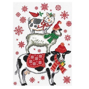 May include: A white cow wearing a red and white hat and scarf stands on a white sheep wearing a green scarf. A white pig wearing a red bow and a red hat stands on the sheep. A red cardinal sits on the pig's back. The animals are surrounded by red snowflakes on a white background.