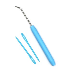 May include: A light blue crochet hook with a silver metal hook and a matching light blue handle. Two light blue yarn needles are also in the image. The tools are set against a white background.