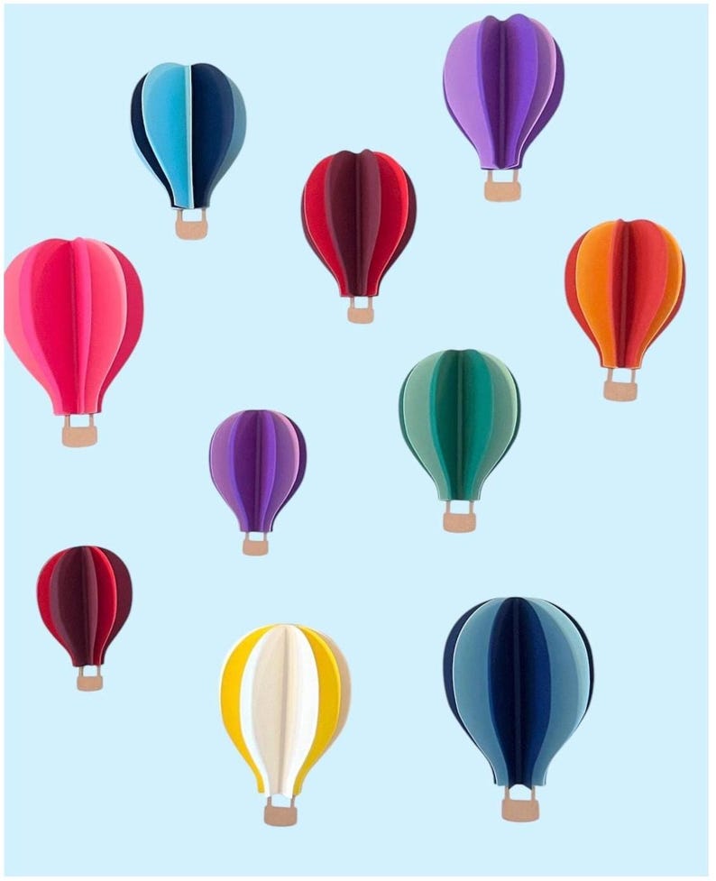 May include: A collection of 10 colorful hot air balloons in various shades of blue, purple, red, green, yellow, and orange. The balloons are all in the same style, with a rounded shape and a basket at the bottom.