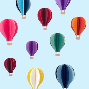 May include: Ten colorful hot air balloons against a light blue background. The balloons are in various colors including red, pink, purple, blue, green, yellow, and orange.