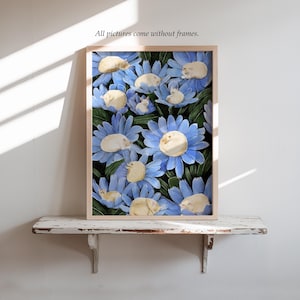 May include: A framed print featuring a whimsical illustration of sleeping cats nestled among large blue flowers. The artwork has a light wooden frame and the text "All pictures come without frames." is visible.