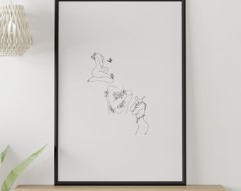 May include: Black and white line art print of two figures with flowers and a butterfly. The print is framed in a black frame and hanging on a white wall.
