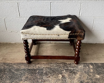 Spanish Twist Leg Cowhide Ottoman - Dark Brown + Tan and White. Always sells out!