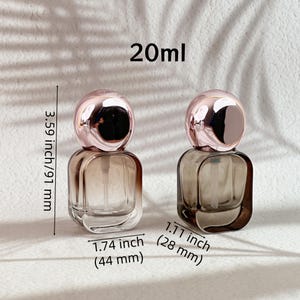 20ml perfume bottles with rose gold caps removed, showing the white spray pumps and different glass finishes.