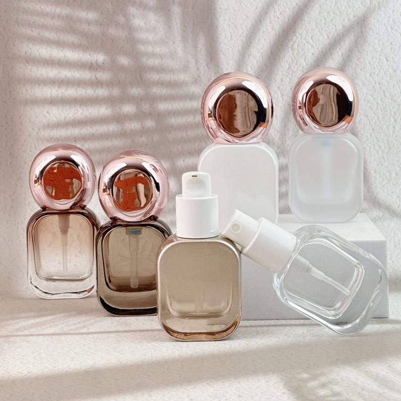All six 20ml perfume bottle finishes displayed together, with rose gold caps and white spray pumps.