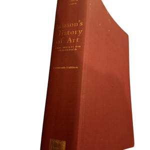 May include: A hardcover book titled "Janson's History of Art" in a reddish-brown color. The book's title and author's name are in gold lettering. The book is the seventh edition of "The Western Tradition."