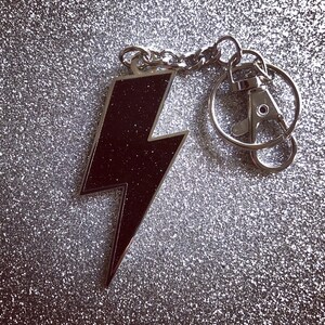 Lightning Bolt Keychain – Black Glitter with Silver Metal Metal Rock-n-Roll Accessory | TN’L Powerage