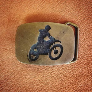 Vintage 1970s Dirt Bike Belt Buckle – Motocross Rider Silhouette – Brass & Black – Biker Americana Accessory – One of a Kind