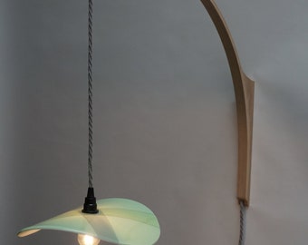 Wall light with kiln formed opaque glass shade in mint green.