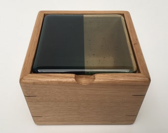 Jewellery box with steel blue and tint kiln formed glass lid.  Available in iroko, oak or cherry.  Walnut currently out of stock.