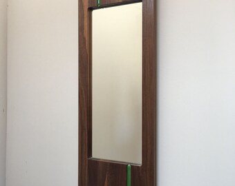 Walnut wall mirror with bright green glass stripe