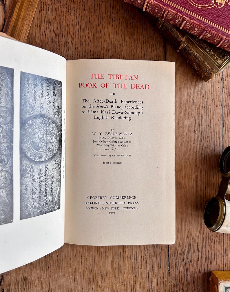 May include: The cover of a book titled "The Tibetan Book of the Dead" by W.Y. Evans-Wentz. The book was published by Oxford University Press in 1949.