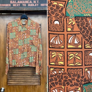 May include: A brown, green, and yellow patterned long-sleeved shirt with a collared neckline. The pattern features sailboats, palm trees, and waves.