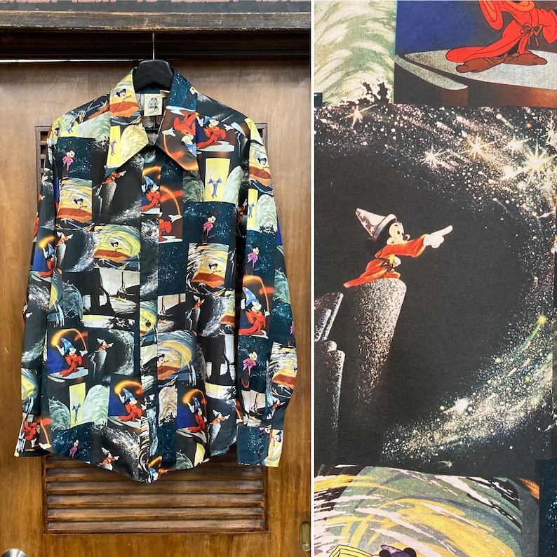 May include: A black button-down shirt with a colorful print of various Disney characters, including Mickey Mouse, Donald Duck, and Goofy. The shirt features a variety of scenes from classic Disney films.