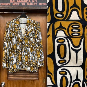 May include: A vintage blazer with a unique pattern in shades of gold, black, and white. The jacket is hanging on a wooden door. The pattern is repeated on a separate fabric swatch. The text "SALAMANCA, N.Y. CORNER NEXT TO DUDLEY HOTEL" is visible.