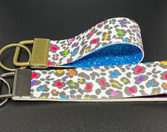 LF themed faux leather key fobs, two sizes available, blue HTV glitter and Purple HTV Glitter, 10 inch and 7 inch available