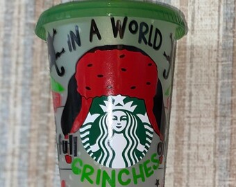 Christmas Movie Character themed 24oz color changing confetti tumbler.