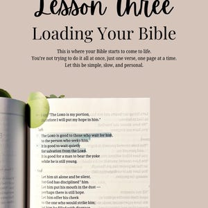 May include: A page from a Bible with the text Lesson Three Loading Your Bible at the top. Below, the text reads: This is where your Bible starts to come to life. You're not trying to do it all at once, just one verse, one page at a time.