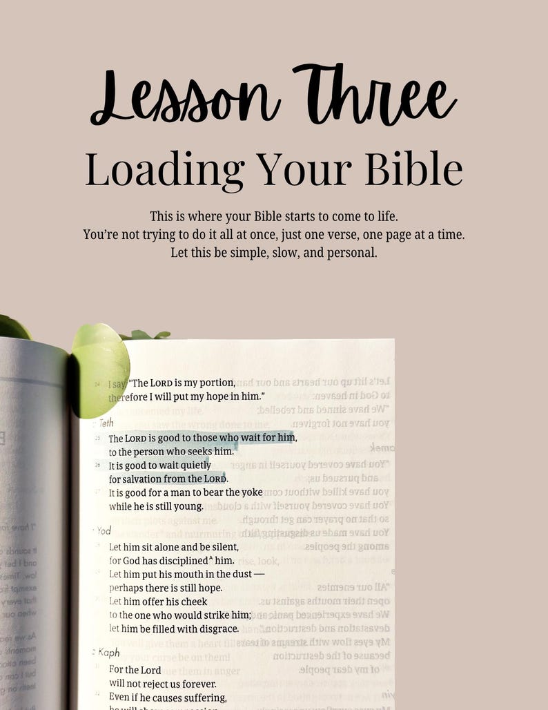 May include: A page from a Bible with the text Lesson Three Loading Your Bible at the top. Below, the text reads: This is where your Bible starts to come to life. You're not trying to do it all at once, just one verse, one page at a time.