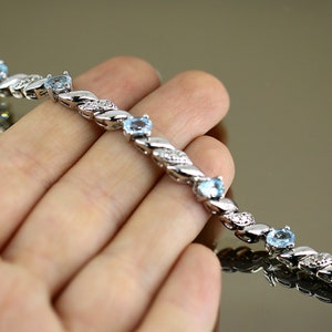 Vintage brillante ovalado cristales azules CZ pulsera de tenis 925 Sterling BR 311-E