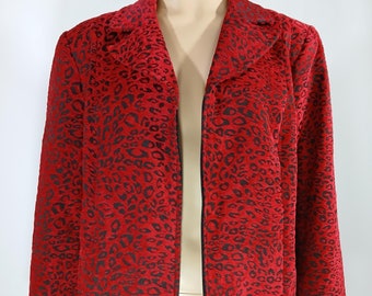 May include: A red jacket with a black leopard print. The jacket has a zipper closure and long sleeves.