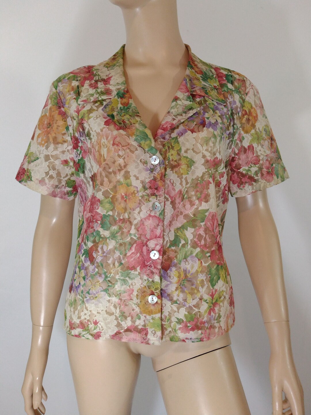 Petite chemise disco courte à fleurs et à manches longues à