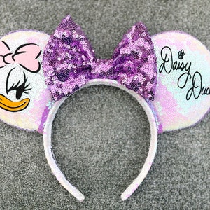 Babyhug Fur Ear Muffs with Daisy Duck Patch - White main image 1