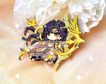 May include: An enamel pin depicting a chibi character with purple hair, a golden bow and arrow, and elaborate attire. The pin features gold and yellow detailing, with a white and purple dress. The pin is set against a soft pink background.