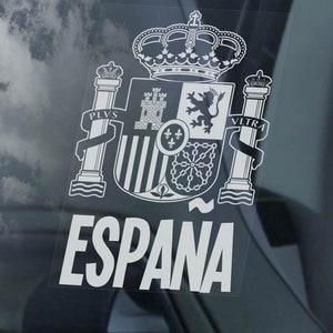 以下が含まれることがあります： スペインの国章と「ESPAÑA」という文字が書かれた白いビニールステッカー。国章には王冠、ライオン、城が描かれている。