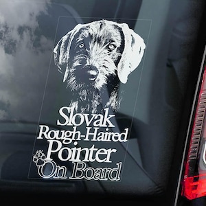 May include: White vinyl sticker featuring a black and white illustration of a Slovak Rough-Haired Pointer dog. The text "Slovak Rough-Haired Pointer On Board" is positioned below the dog.