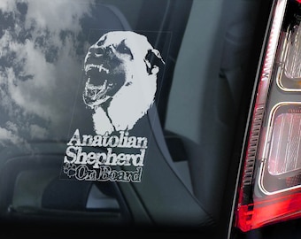 Könnte beinhalten: Ein weißer Aufkleber auf einer Autoscheibe zeigt eine detaillierte Illustration eines Anatolischen Schäferhundes mit offenem Maul. Der Text "Anatolian Shepherd On Board" befindet sich darunter.