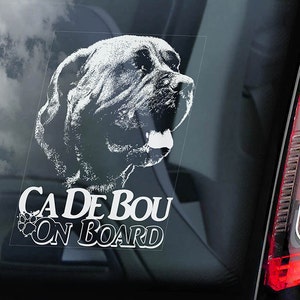 May include: White vinyl sticker with a black and white illustration of a dog's head and the text "Cade de Bou On Board".