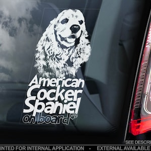May include: White car window sticker with a white silhouette of an American Cocker Spaniel dog and the text "American Cocker Spaniel on board".